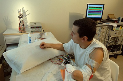 An amputee operates a bionic hand that is connected directly to his nervous system. 